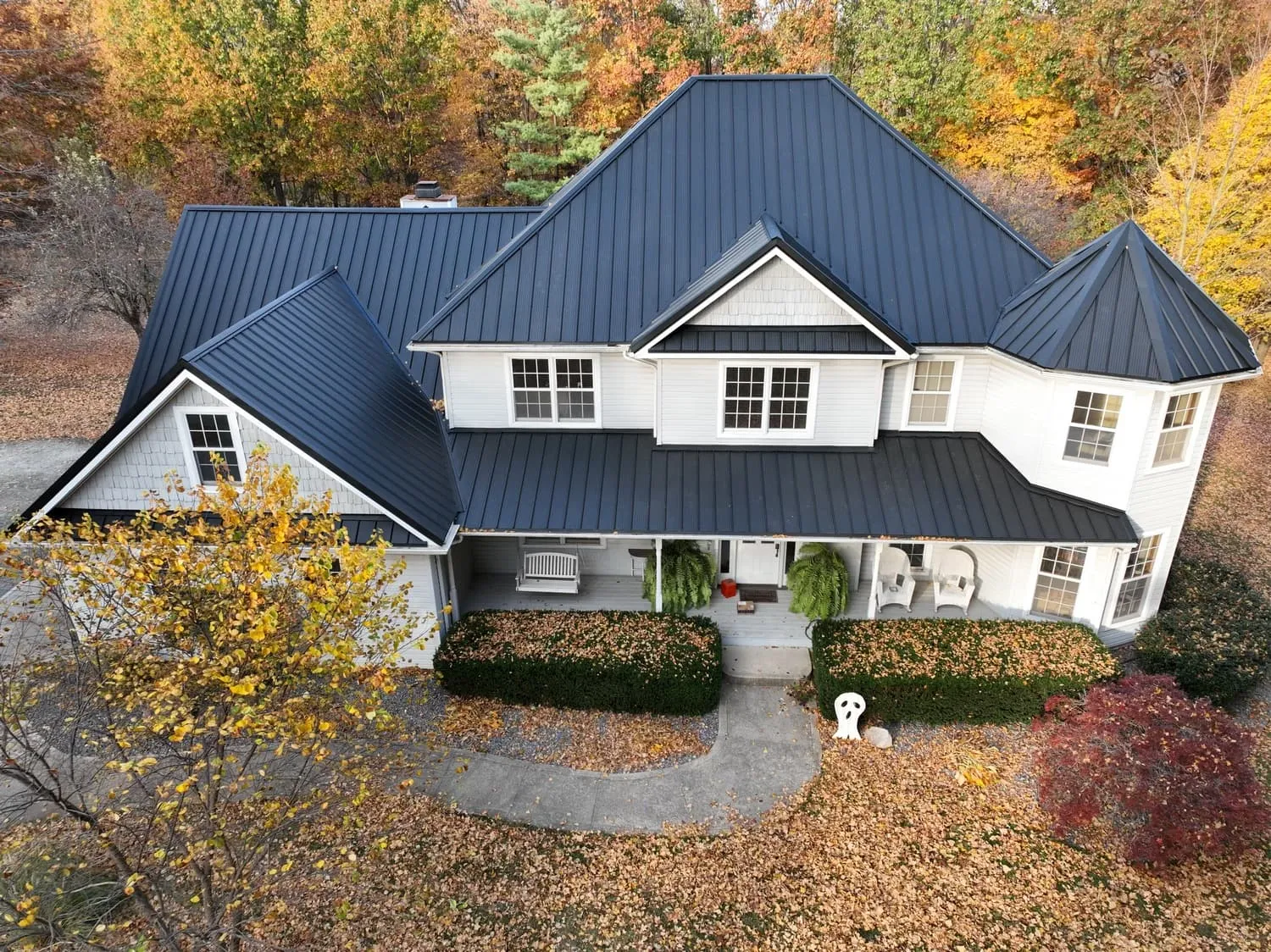 Two-story home with a new dark metal roof